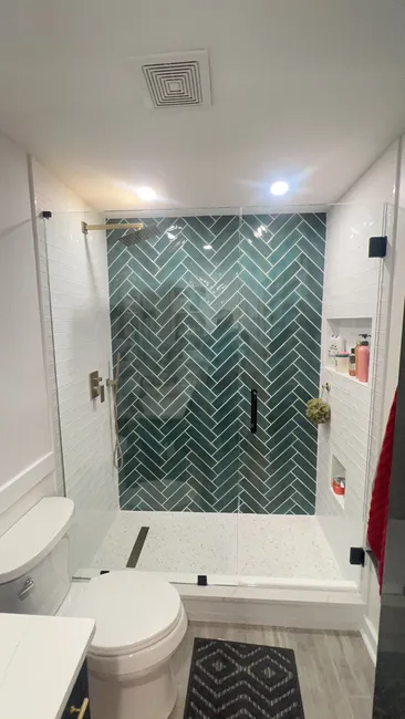 We installed a sleek two-panel swing shower door, enhancing both functionality and style in this bathroom.