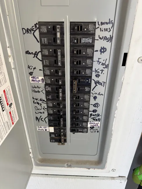 Arrived to address a sizzling water heater breaker, replacing it with a safer option and correcting wiring issues.