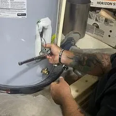 Teaching our apprentice Keira how to change a water heater element
