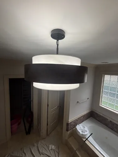 Installed a new light fixture in the master bathroom.