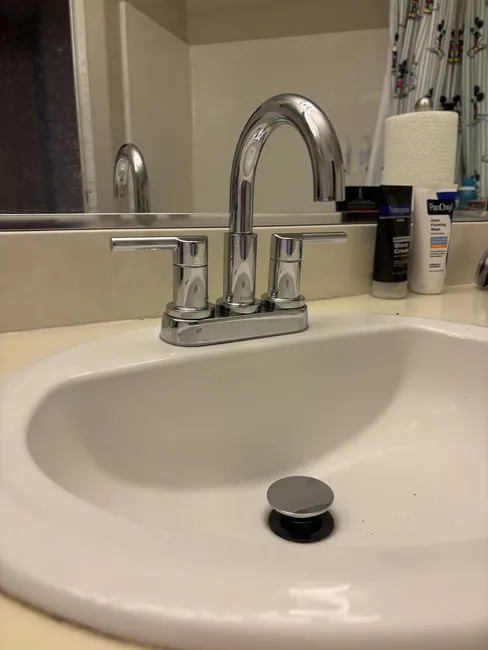 A new widespread bathroom faucet and shut-off valves were expertly installed, enhancing functionality and style.