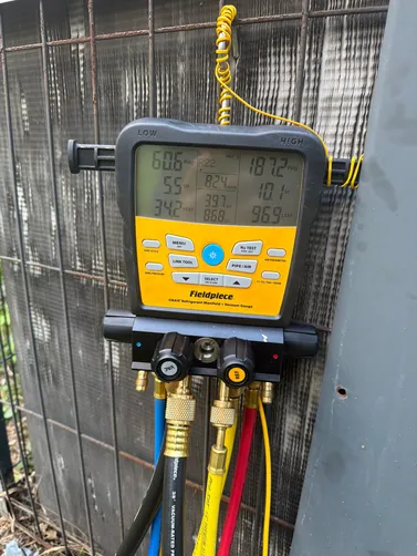 HVAC diagnostic gauges photographed at an Alabaster home