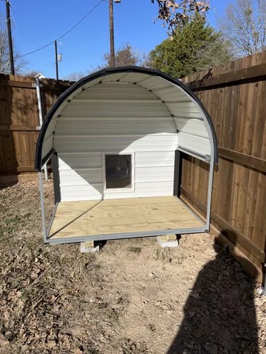photo at West Tawakoni, TX on Jan 16, 2026: 6x8 deluxe dog house in brilliant white with black trimIncludes heat, ac, insulation, light, solid